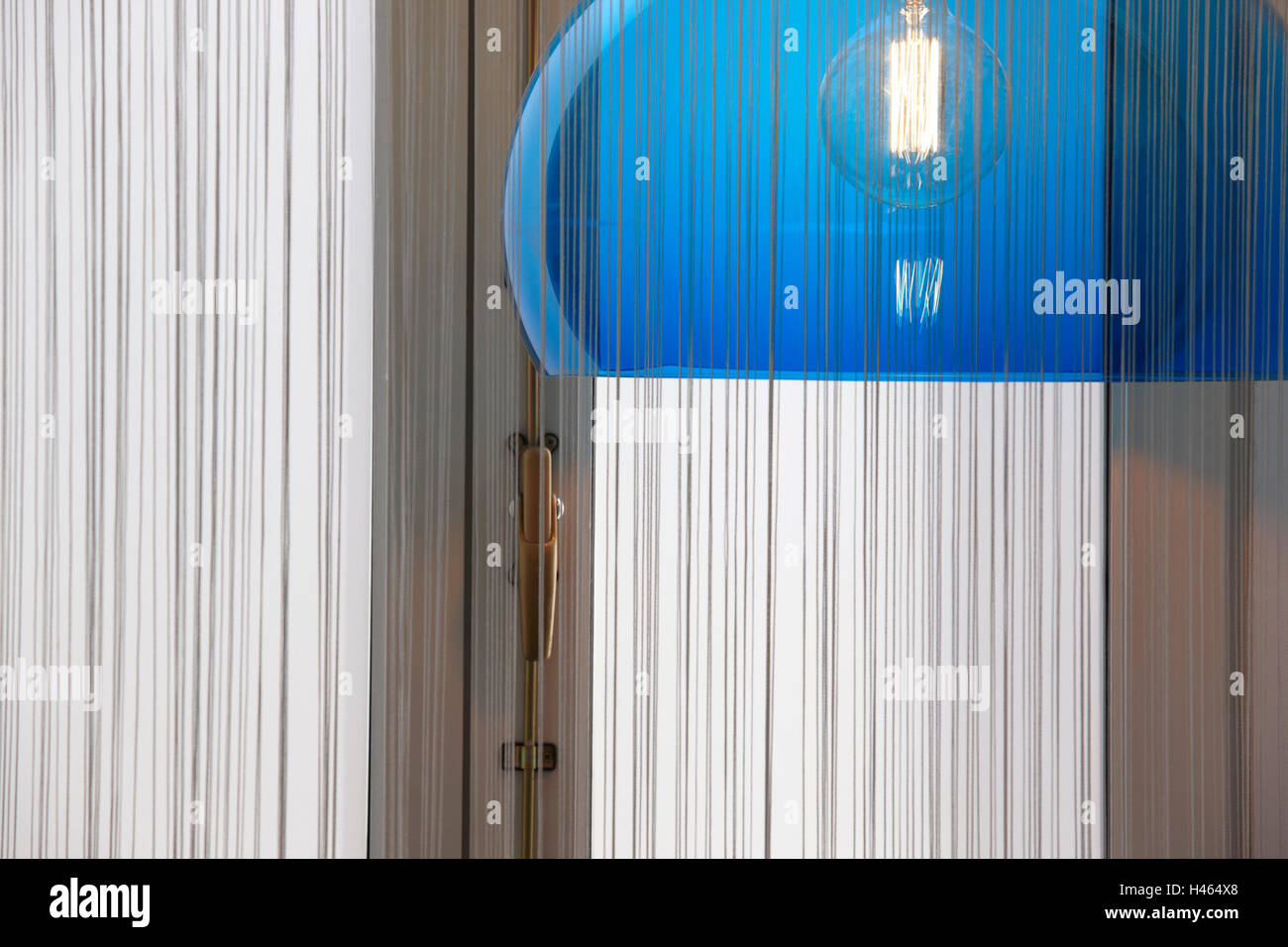 Retro lamp in blue tone with curtain and window. Horizontal Stock Photo