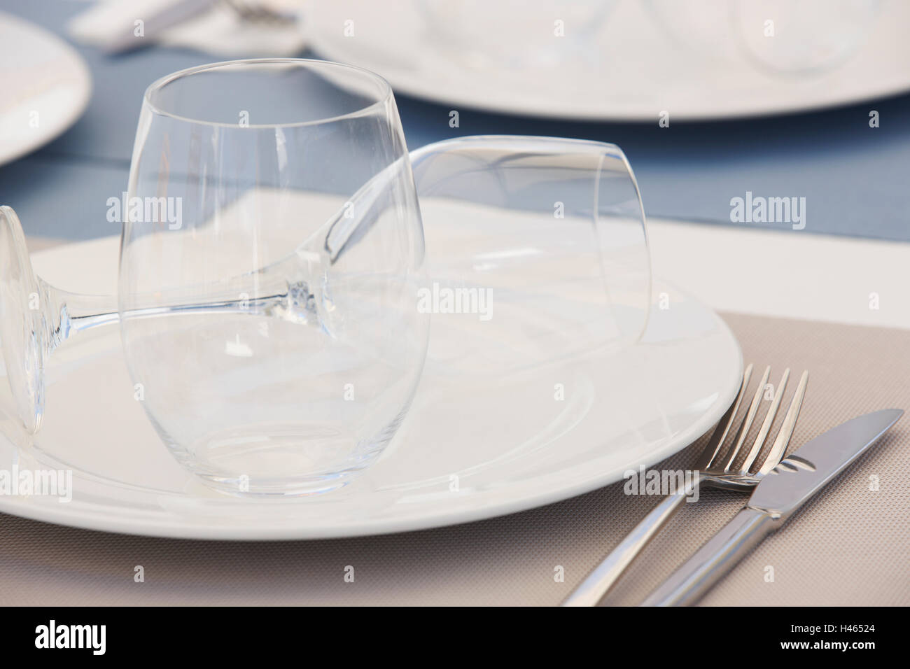 Tableware with dishes and cups detail in a restaurant. Horizontal Stock