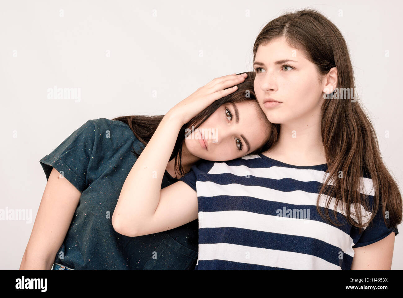 Troubled young girl comforted by her friend Stock Photo - Alamy