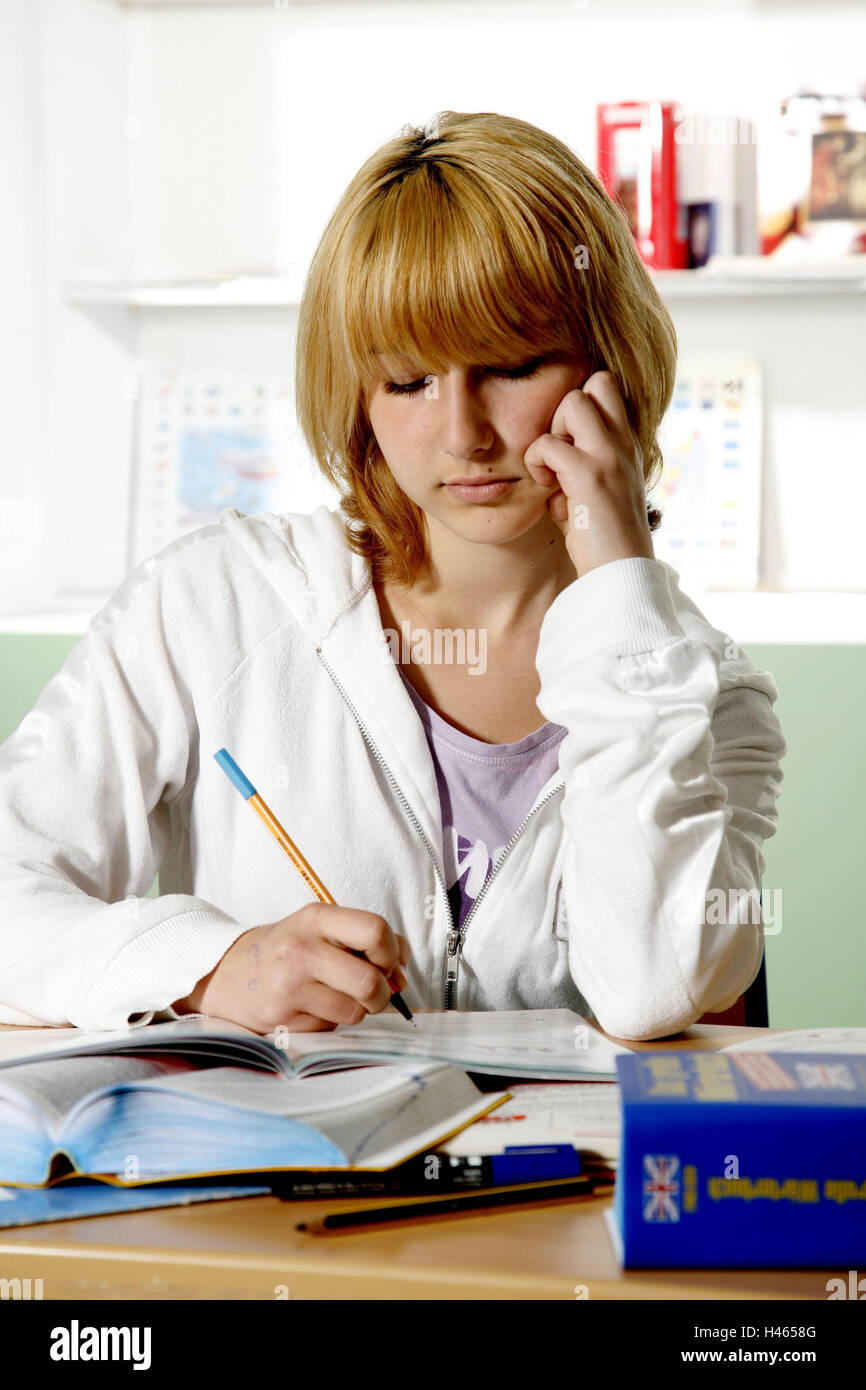 Schoolgirl, write, sit, table, classroom, thoughtful, half portrait, learn, assignment, Duden, foreign language, lexicon, pens, English, school desk, training aid, dictionary, inside, girls, concentration, teenager, youth, young person, education, read, s Stock Photo