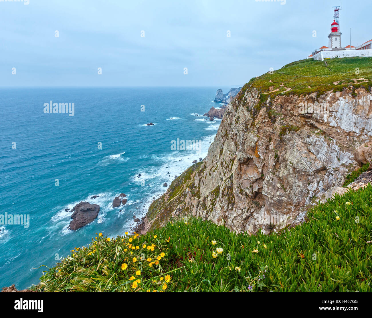 Summer blossoming Cape Roca (Cabo da Roca) with flowers and lighthouse
