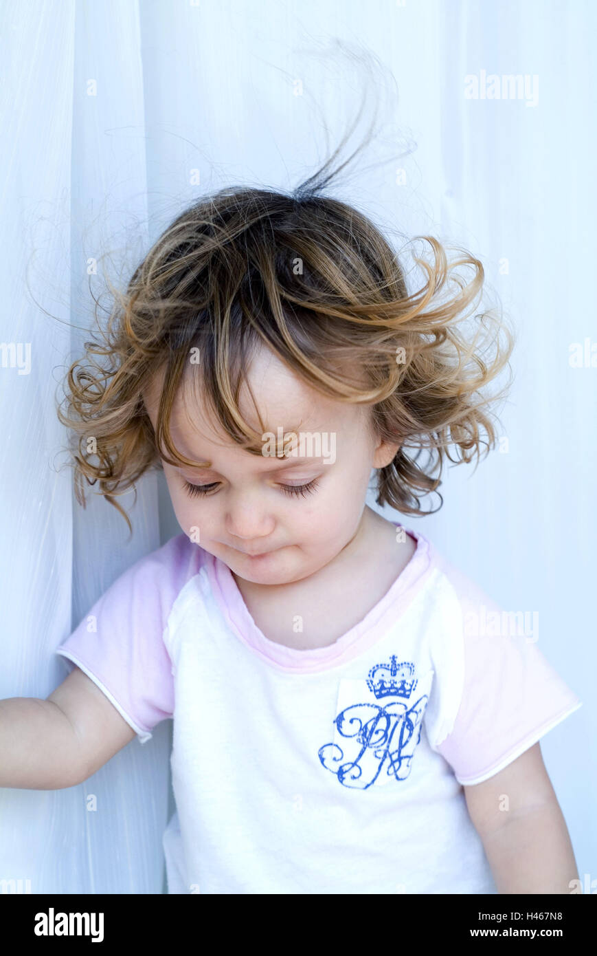 Curtain, toddler, girl, looking down, wind, portrait Stock Photo Alamy