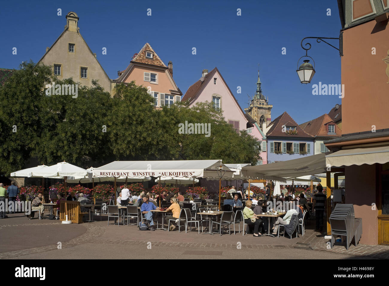 France, Alsace, Colmar, marketplace, restaurant, tourist, steeple, no model release, Oberelsass, town, church, detail, tower, residential houses, houses, facades, brightly, lamp, lantern, person, sit, gastronomy, trees, sunshine, Stock Photo