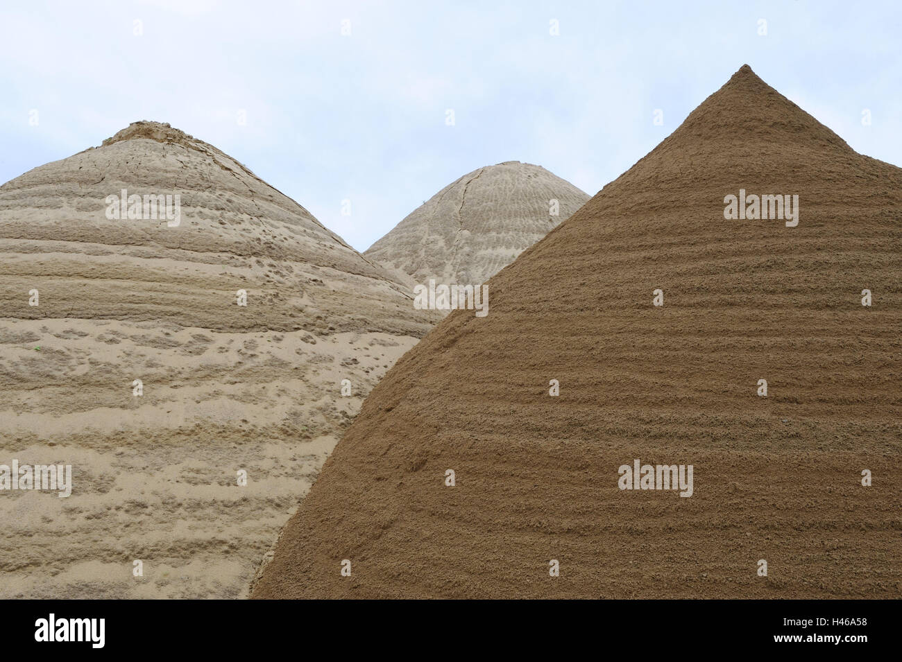 Sand hills, passed away, Sand heaps, Sand mountains, Sand, hill, heap, three, side by side, river sand, Grabsand, economy, building industry, Baggersand, piled up, colours, heavens, clouds, nobody, Stock Photo