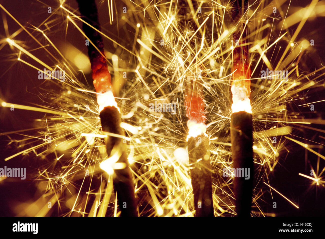 Sparklers, burn, medium closeup, flying sparks, New Year's Eve