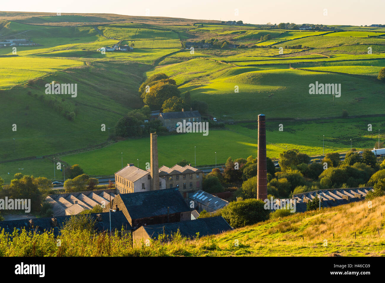 View to Haslingden Moor over mills at Holden Vale from slopes below Top of Slate in the Lancashire Pennines Stock Photo