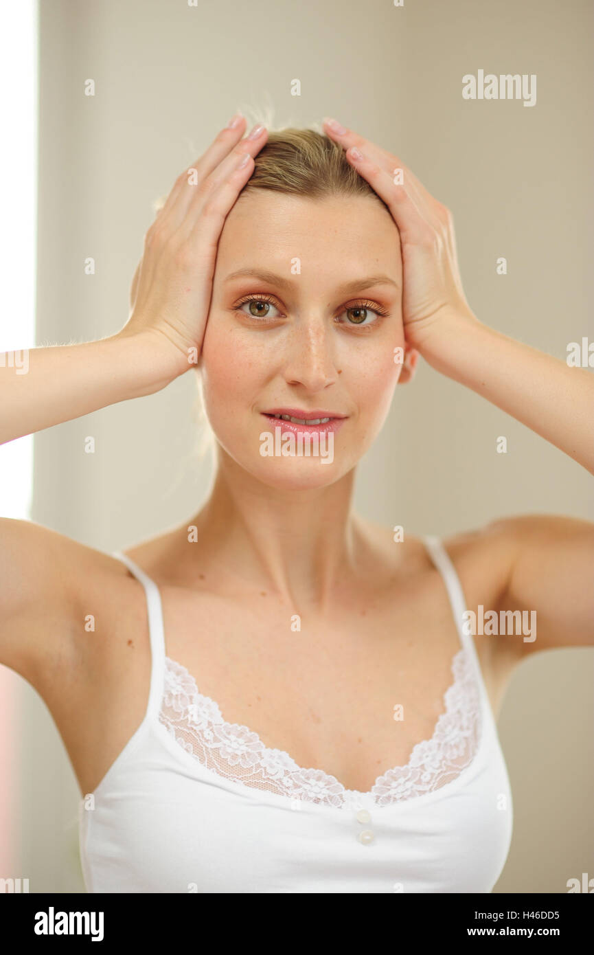 Young woman makes acupressure, Stock Photo