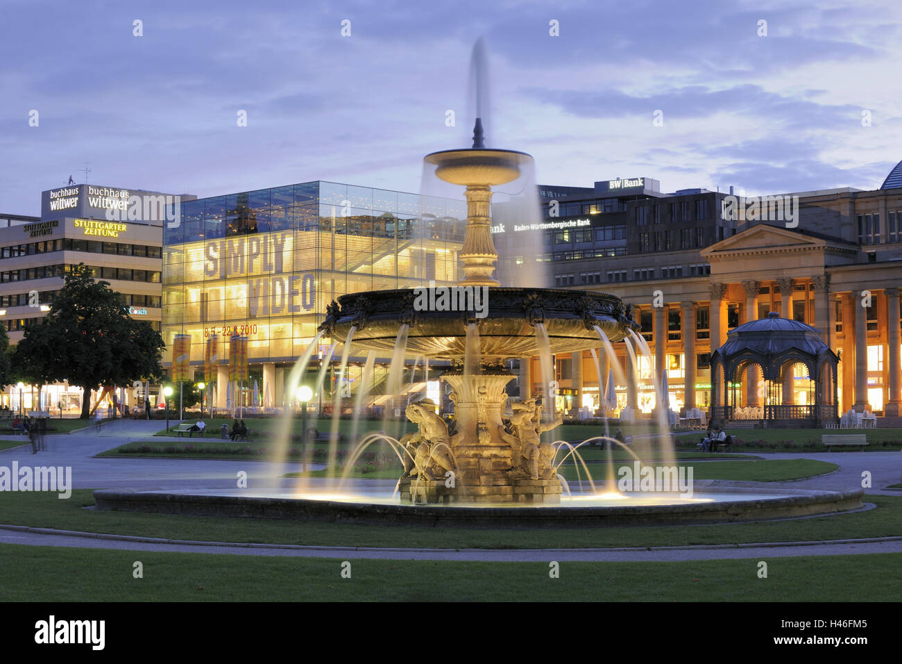 Germany, Baden-Wurttemberg, Stuttgart, castle square, fountain, museum, evening, lighting, architecture, well, culture, play of water, outside, place of interest, tourism, structure, Pureline, destination, illuminateds, water jet, jet, art museum, office Stock Photo