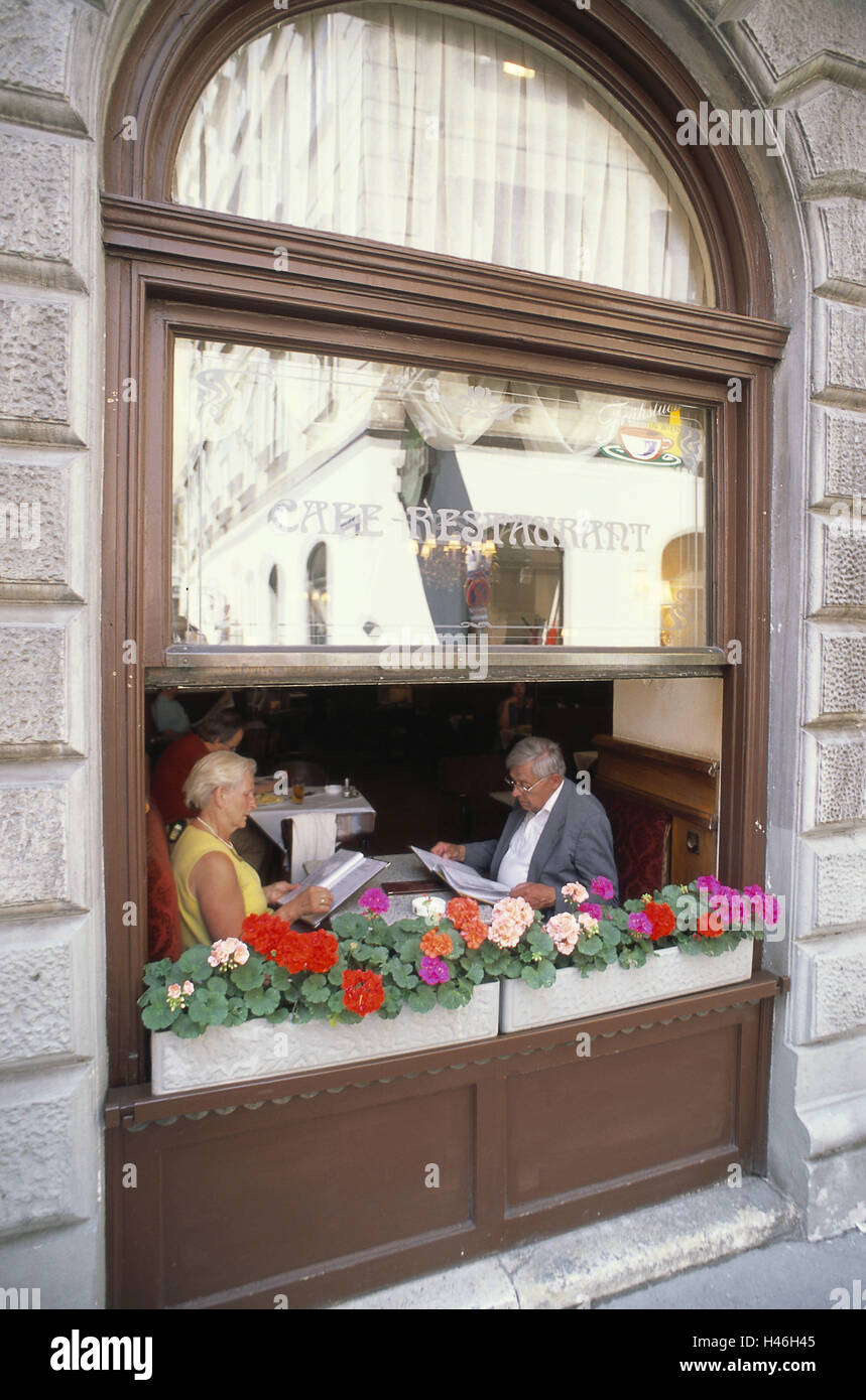 Austria, Vienna, café, window, guests, round arch windows, opened, window boxes, couple, menu cards, choice, select, people, man, woman, Stock Photo
