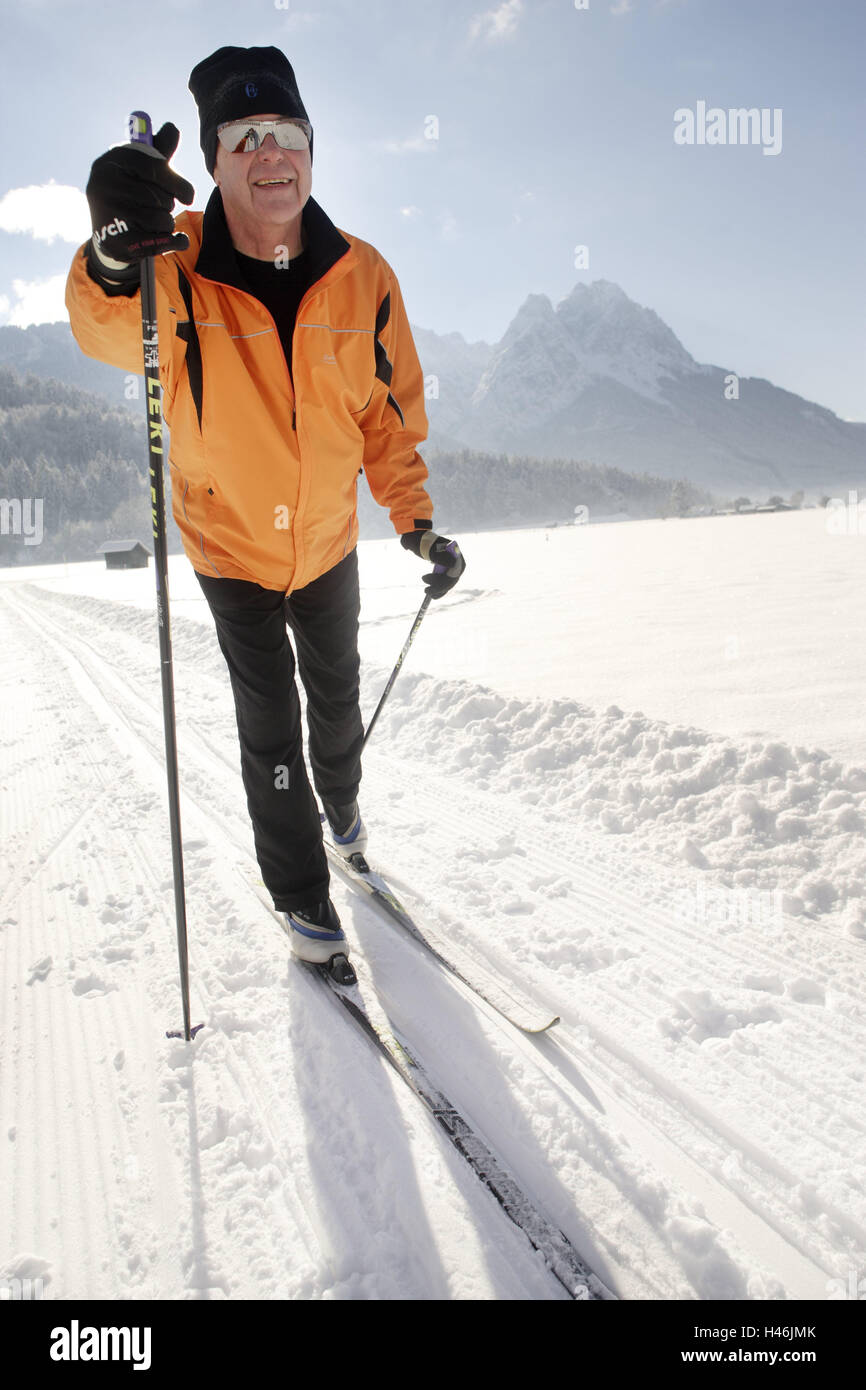 Senior, cross-country skiing, winter sports, mountain landscape, Zugspitze, Garmisch-Partenkirchen, Bavaria, Germany, man, sport, sportily, actively, fit, fitness, going cross-country skiing, cross-country skier, cross-country trail, scenery, mountains, Zugspitze massif, Waxenstein, winter sports place, ski place, winter, fresh snowfall, motion, activity, fun, happy, motivates, heart cycle, health, healthy, senior citizens, old person, actively, Werdenfels, Upper Bavaria, Stock Photo