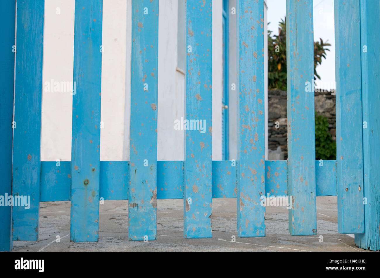 Blue wooden fence in front of white house, Artemonas, island Sifnos, the Cyclades, Greece, Stock Photo