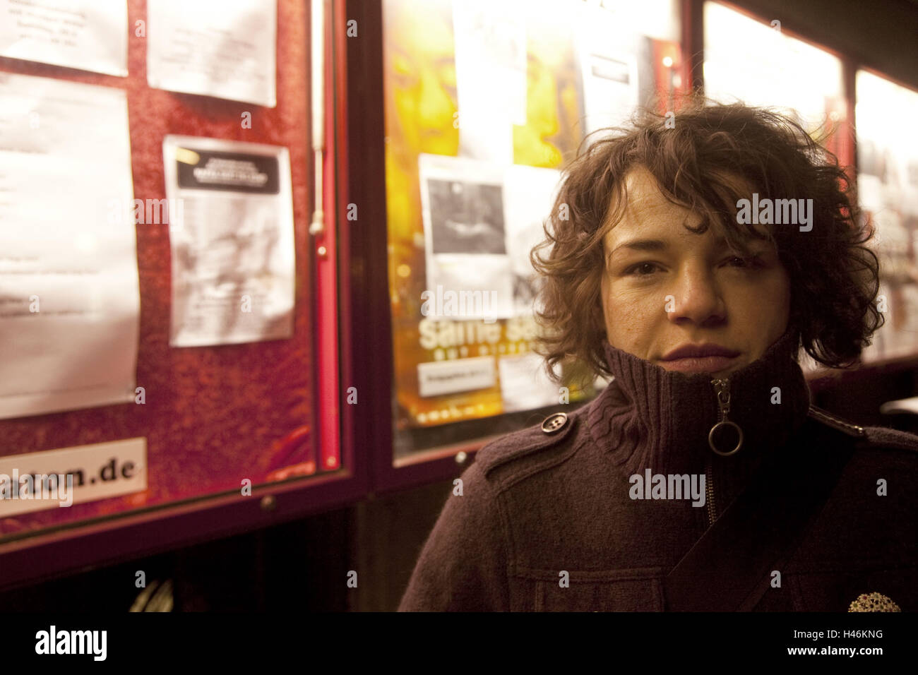 Woman in front of cinema, portrait, Stock Photo