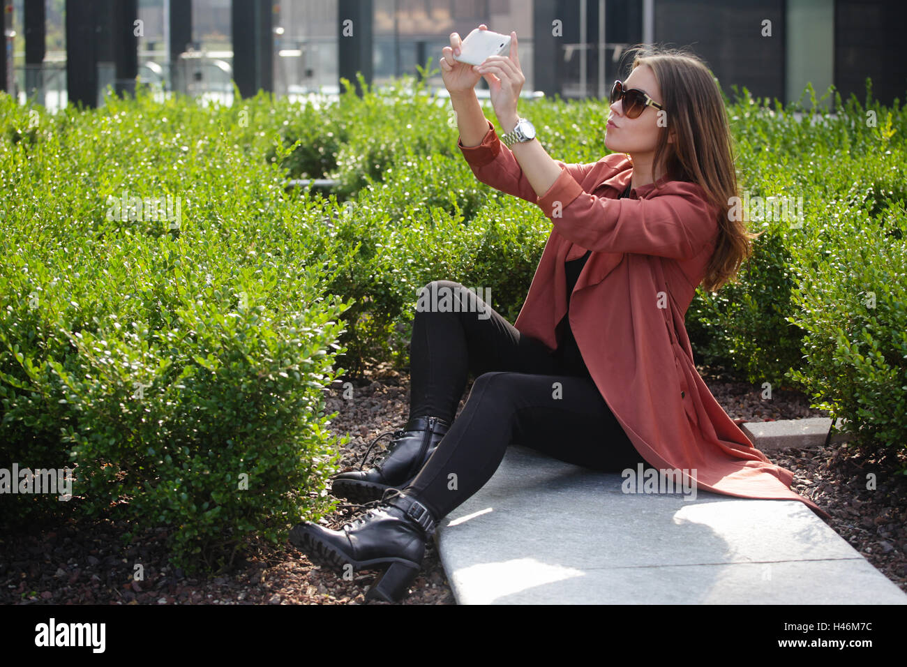 Young beautiful woman taking a selfie in the city Stock Photo - Alamy