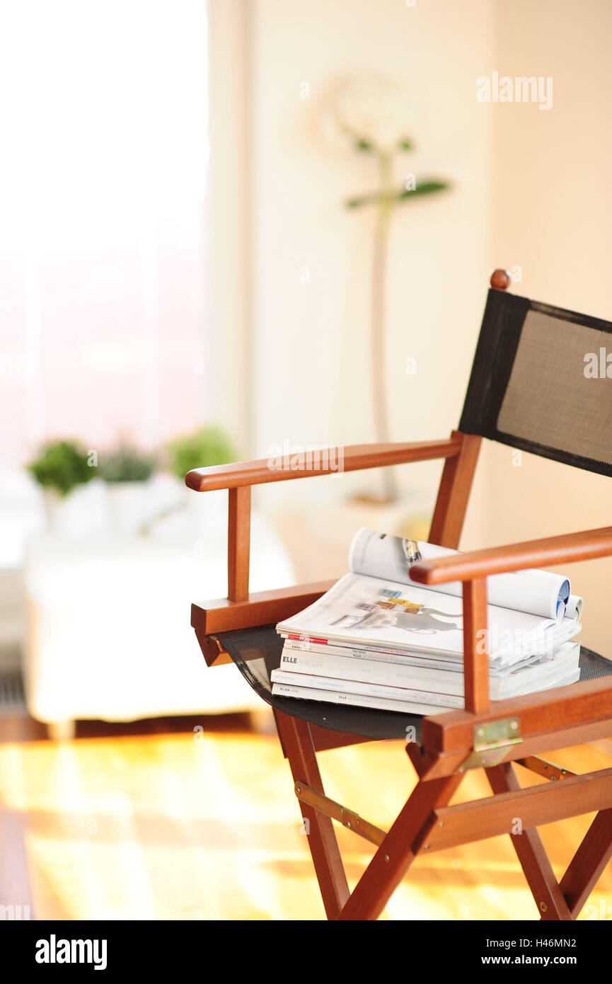 Folding chair with magazines, Stock Photo