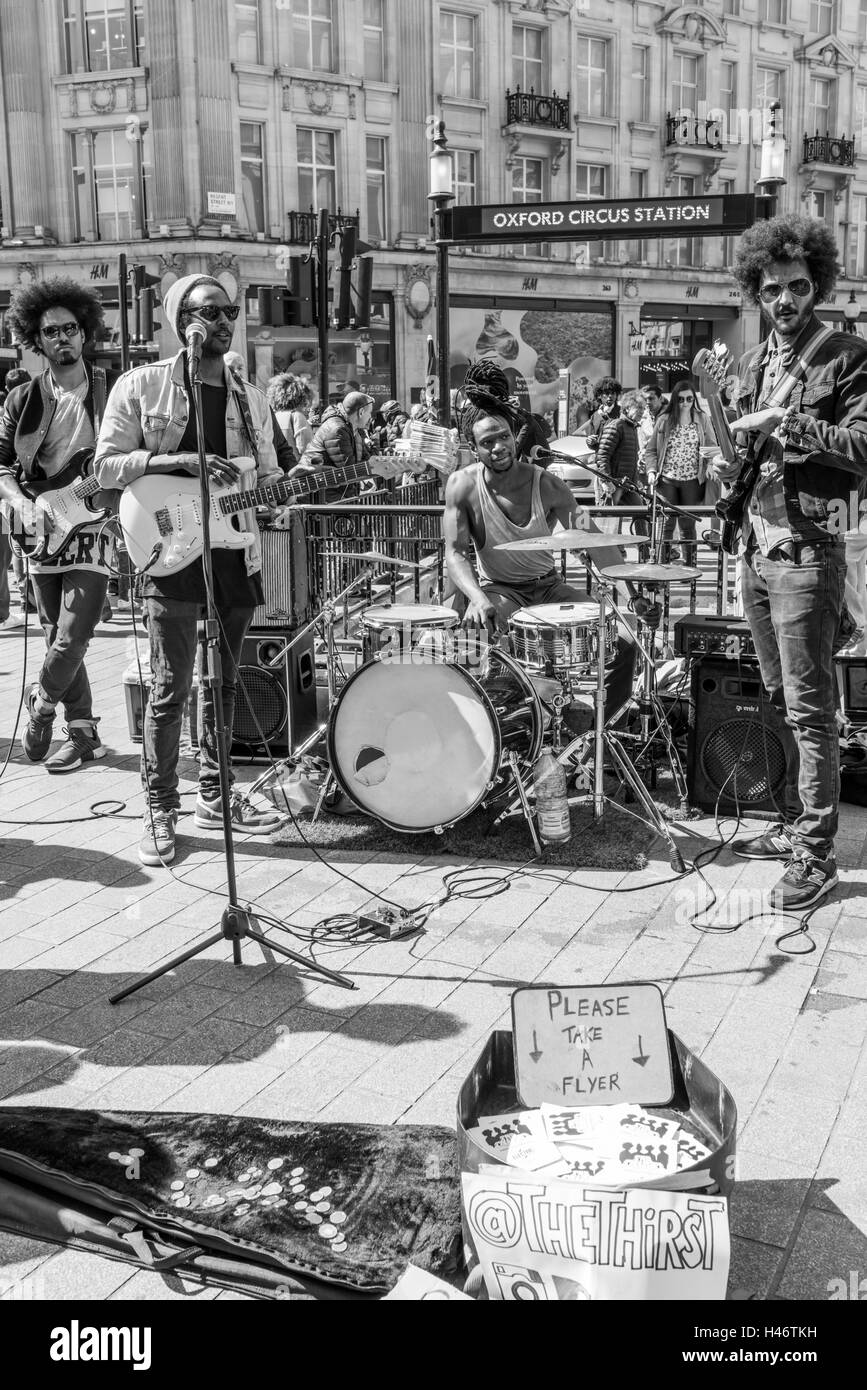 A band of musicians with their instruments standing outside Oxford