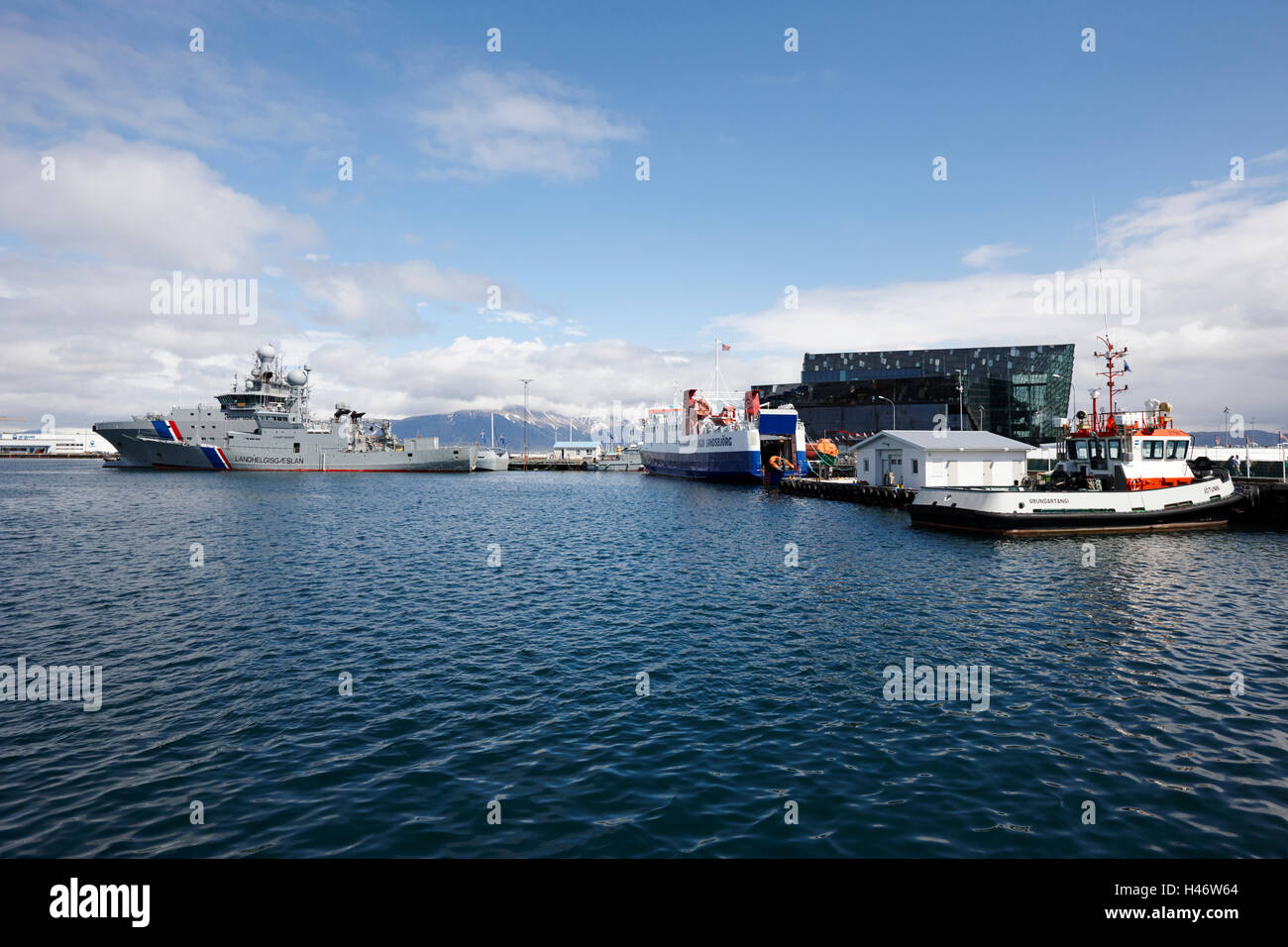 view of reykjavik harbour and harpa concert hall from reykjavik Iceland Stock Photo
