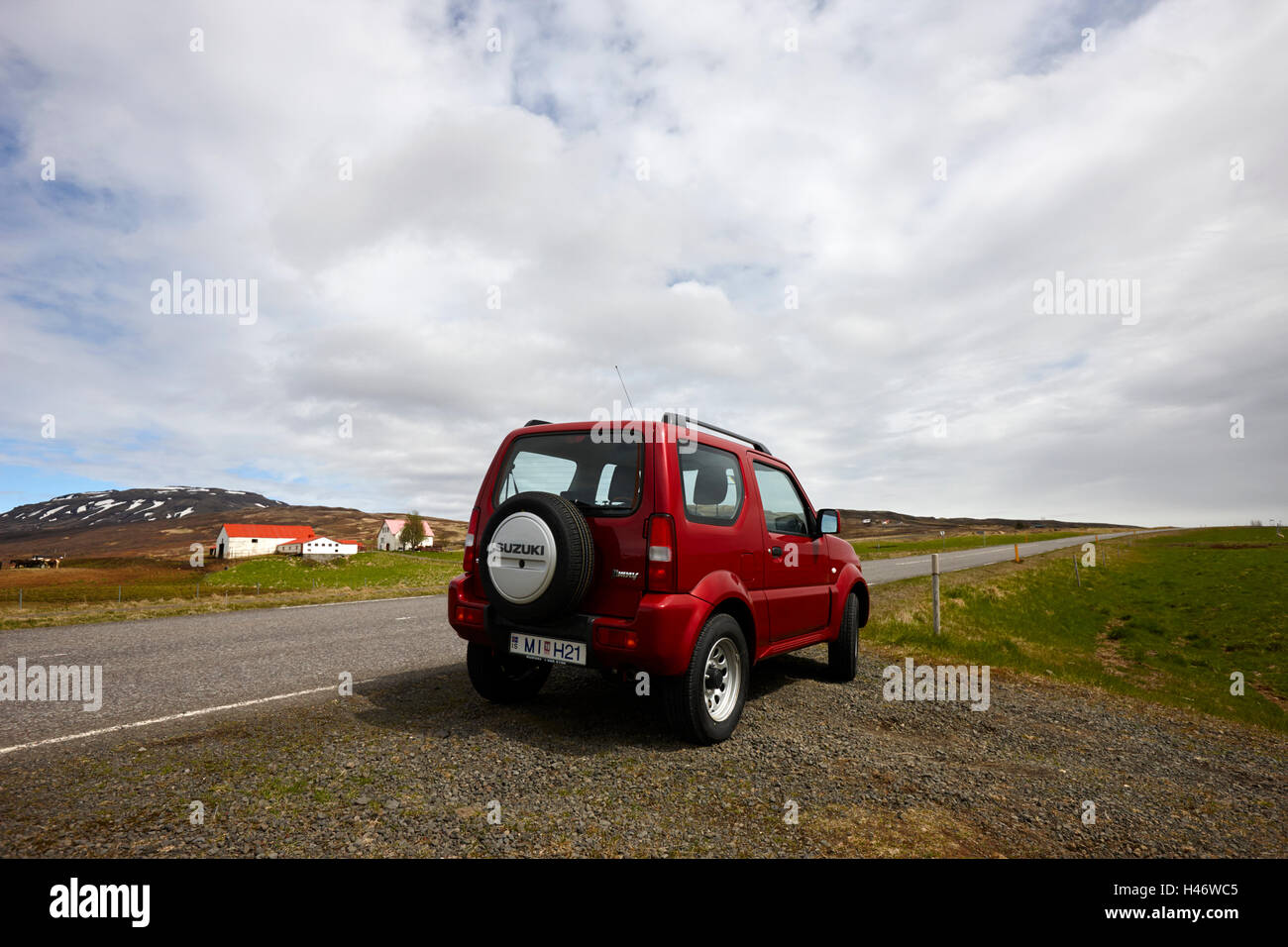 Suzuki jimny 4x4 off road hire car parked by the side of the road Iceland Stock Photo