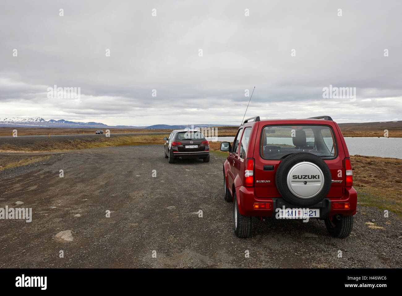 Suzuki jimny 4x4 off road hire car by a lake in thingvellir Iceland Stock Photo