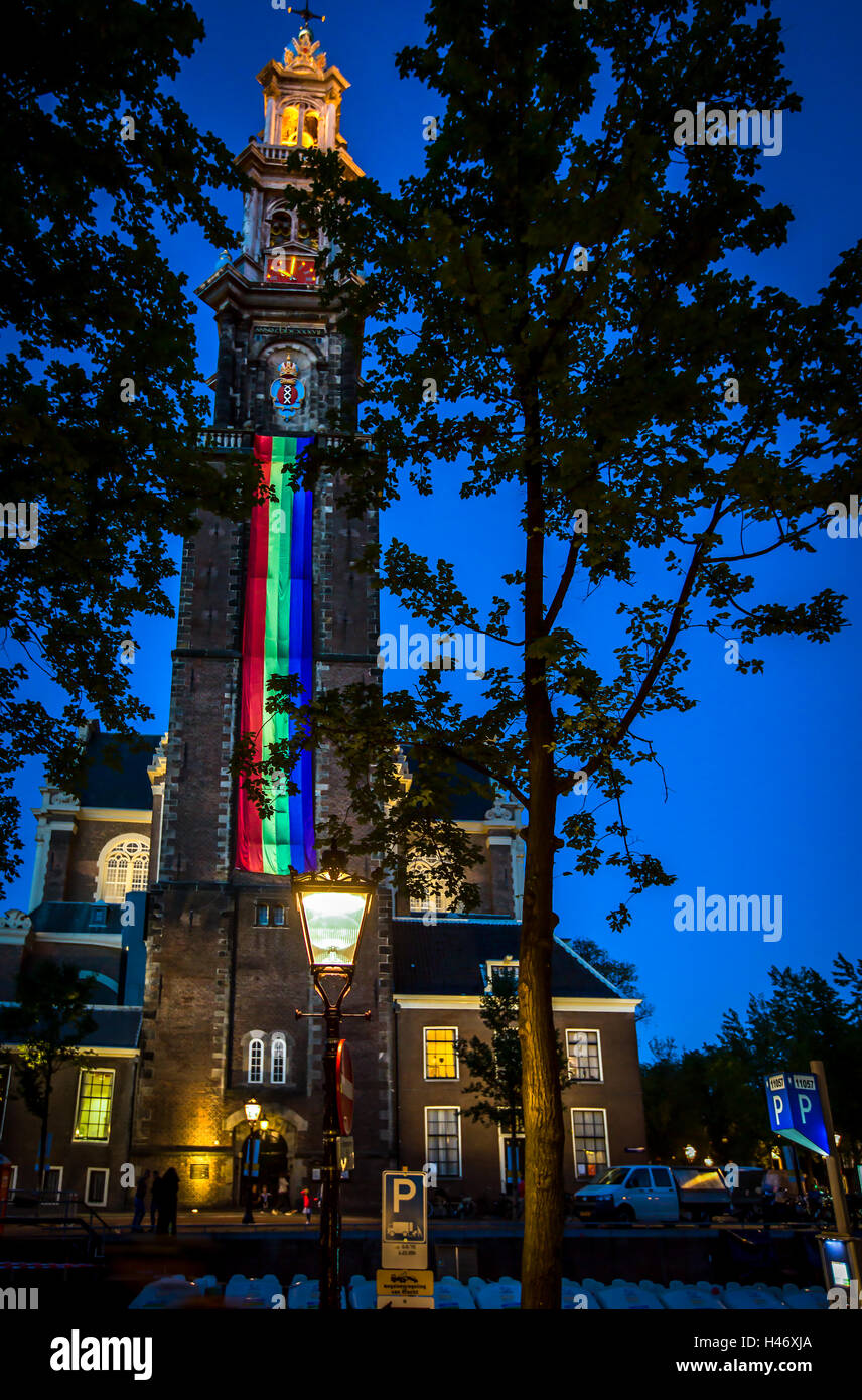 Western church on Prinsengracht canal in Amsterdam with Gay-Pride banner on tower Stock Photo