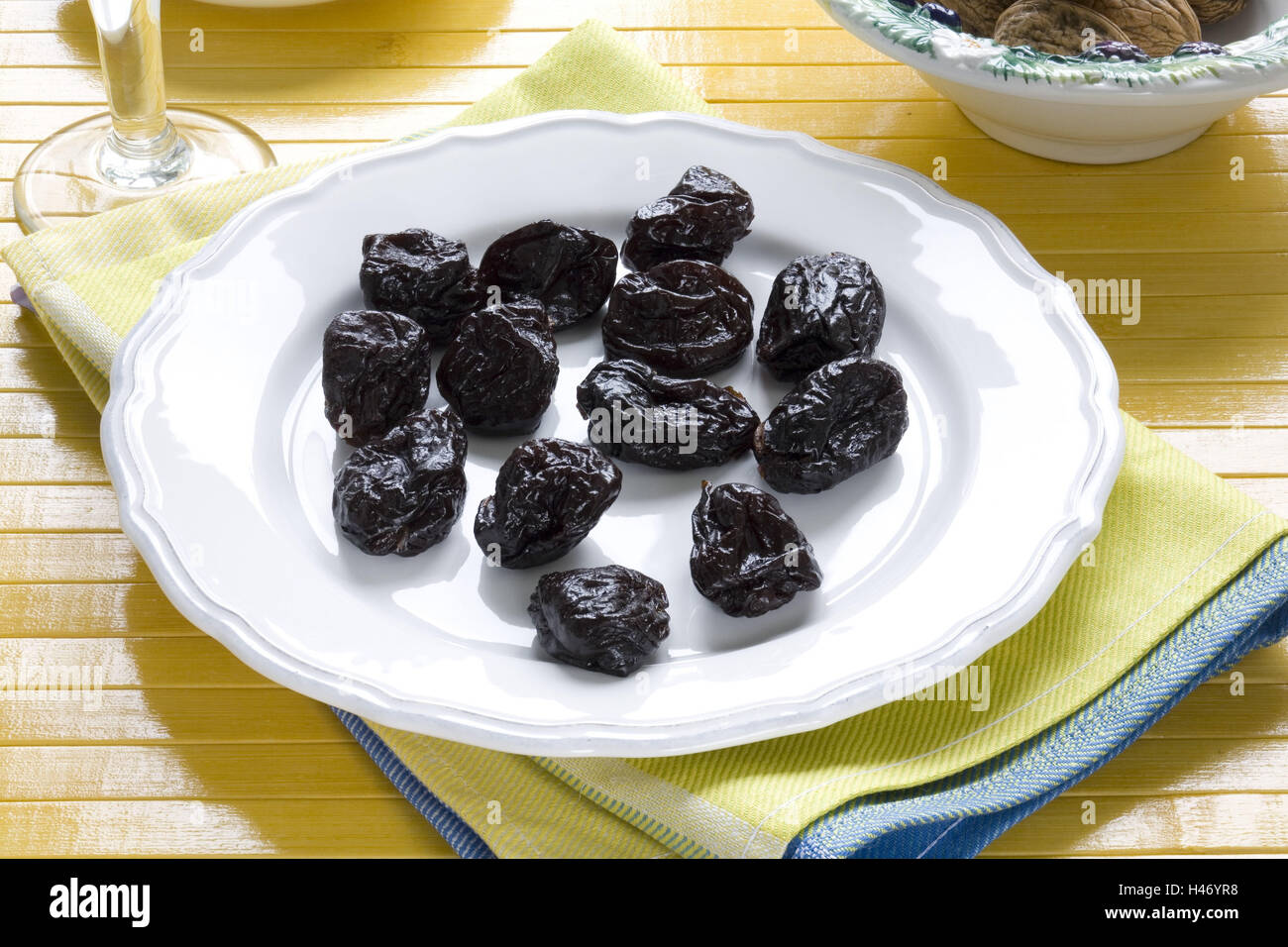 Dry plums on plate, Stock Photo