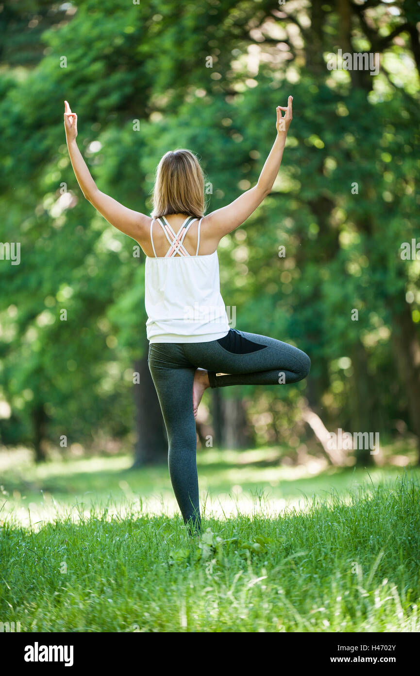 Woman doing yoga exercises Stock Photo