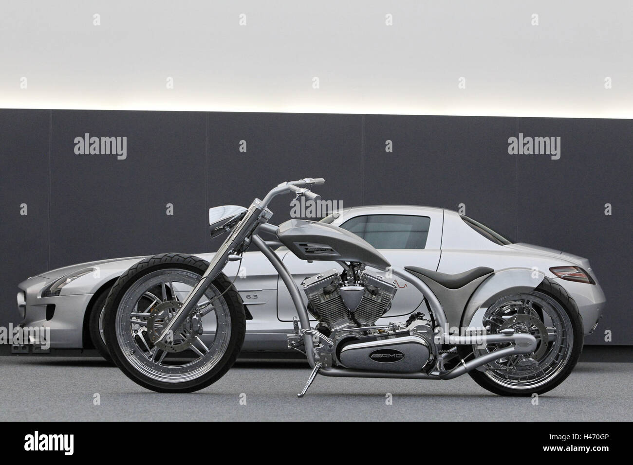 Motorcycle, chopper AMG, design motorcycle, car, Mercedes AMG Wing door model SLS in the background, silver, Stock Photo