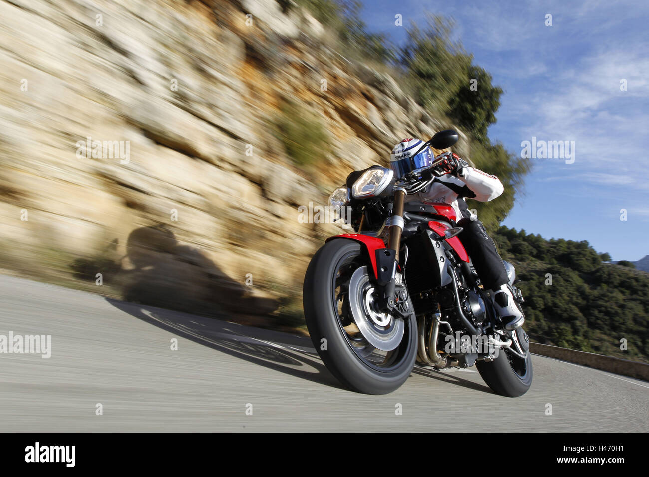 Motorcyclist, triumph, bend, country road, moving, cliff face, the South France, Stock Photo