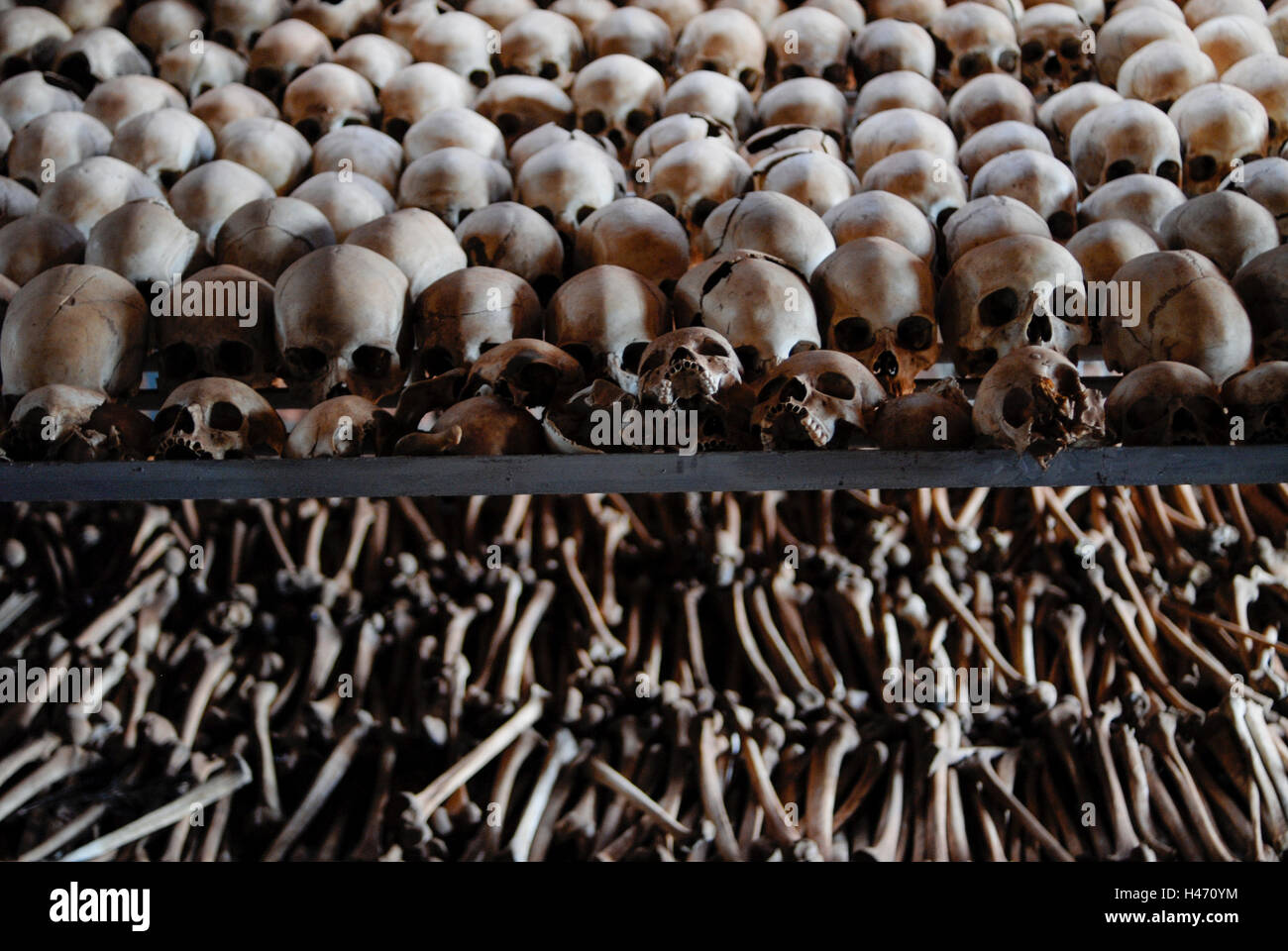 RWANDA Genocide memorial Ntarama , during the genocide in April 1994 about 5000 Tutsi people were killed by Hutu murder in this church, skulls and bones of murdered people in mass grave Stock Photo
