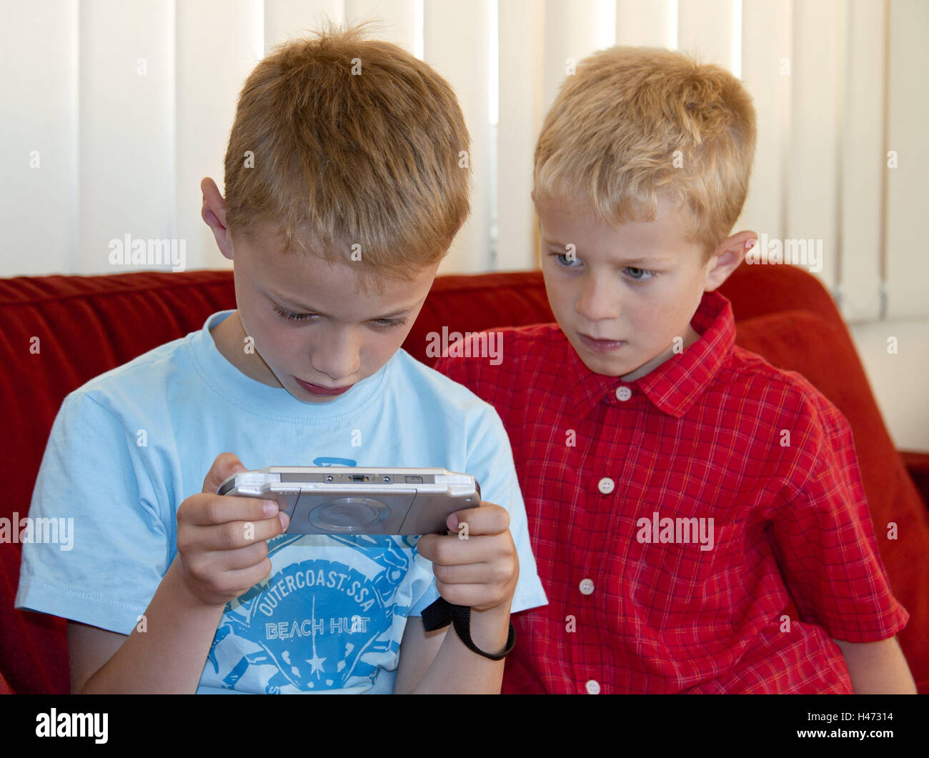 Boys, two, game console, play, concentration, brothers, boys, siblings, Gameboy, children, boys, people, side by side, manly, PSP, excitingly, voltage, game, game console, portrait, Stock Photo