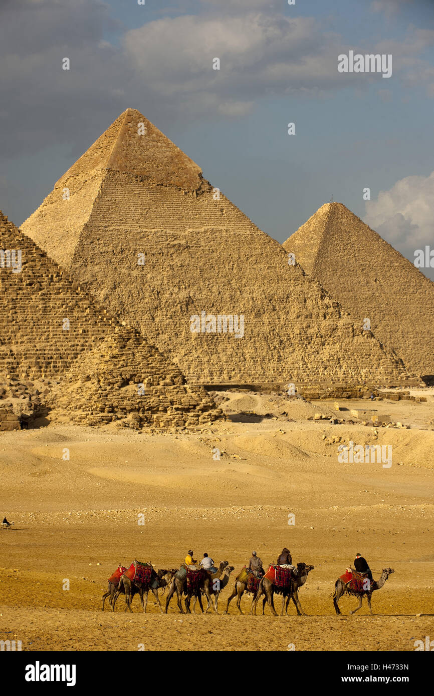 Egypt, Cairo, Gizeh, pyramids, queen's pyramids, Chephren pyramid, Cheops pyramid, Mykerinos pyramid, tourist on camels, Stock Photo