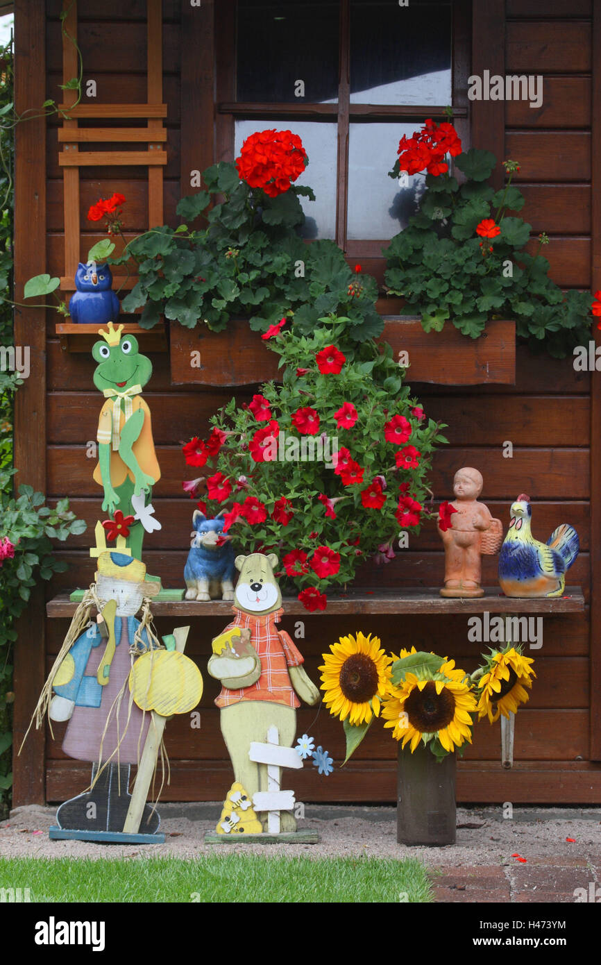 Summer house with flowers and figures in summer Stock Photo - Alamy