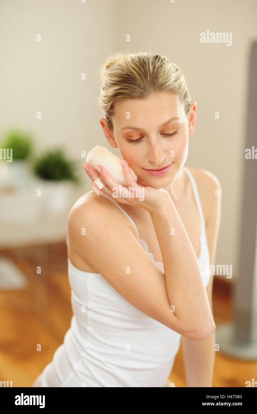 Young woman holds powder puff in the hand Stock Photo Alamy