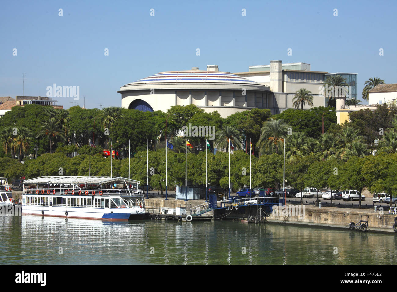 Spain, Andalusia, Seville, view over Rio Guadalquivir on the Paseo de Cristobal Colon with bullfight arena, Stock Photo