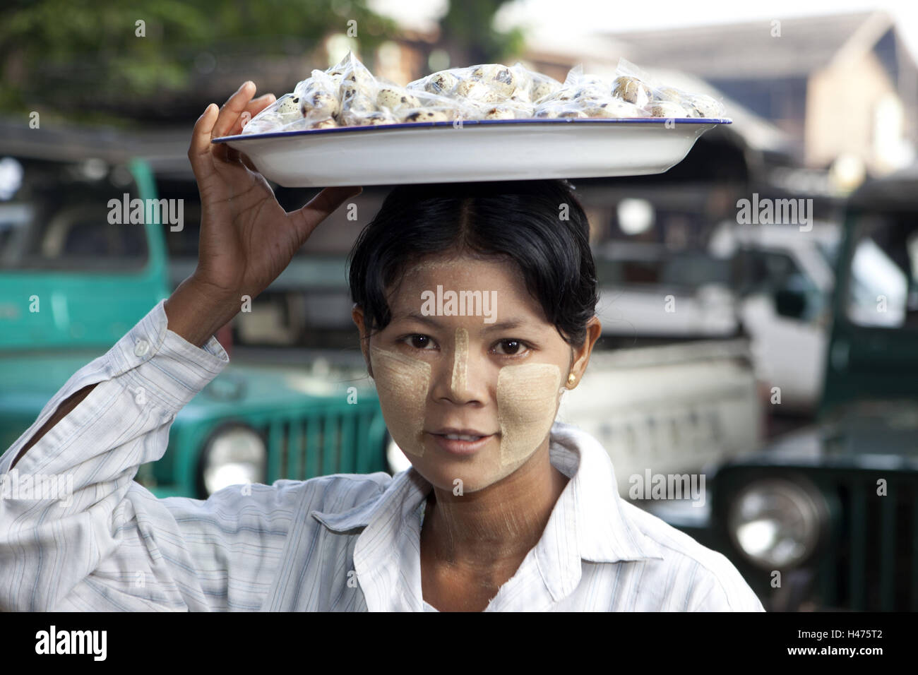 Myanmar, young Burmese sells quail's eggs Stock Photo - Alamy