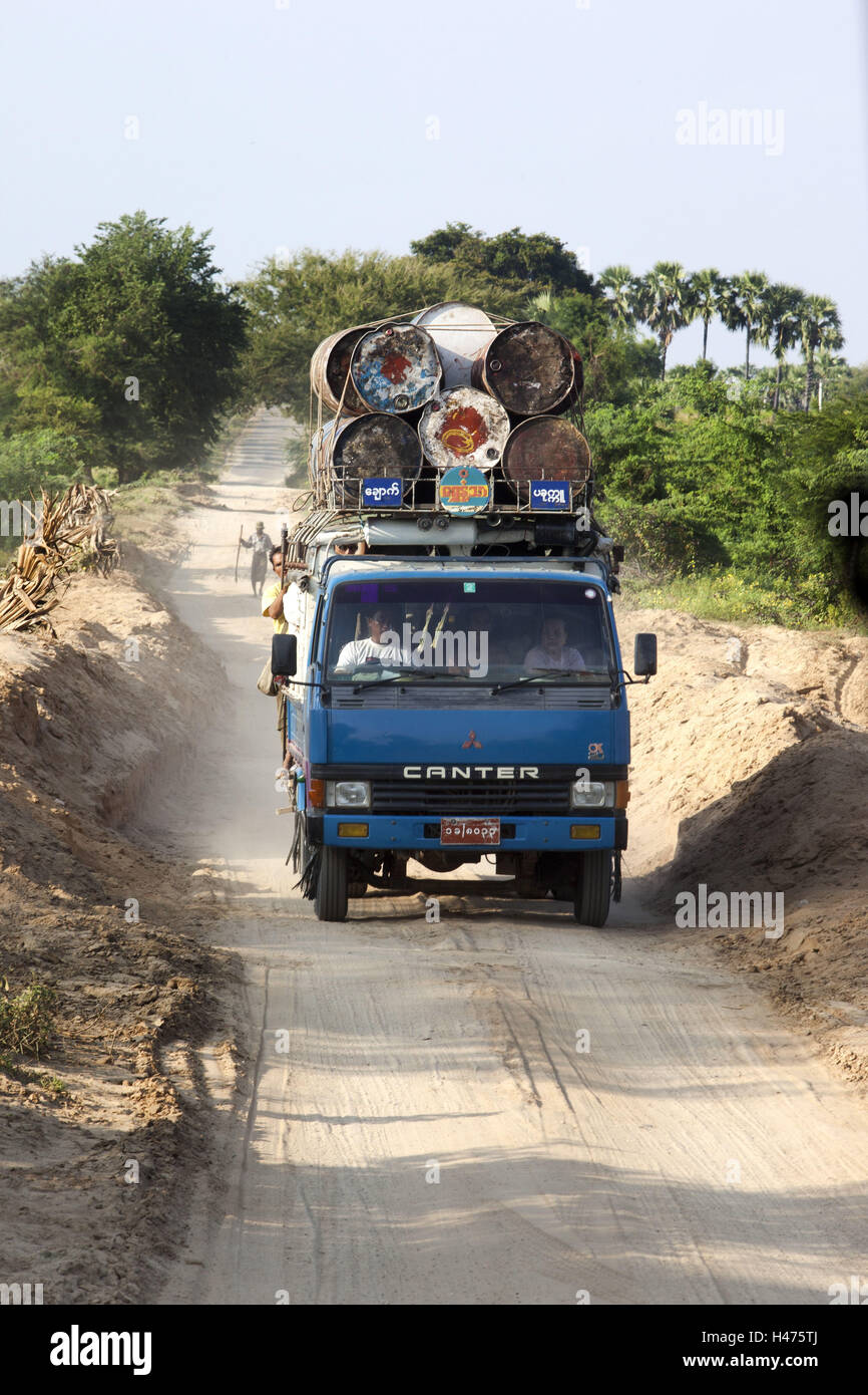 Truck overloaded with plastic containers - Stock Image - C047/7908 -  Science Photo Library