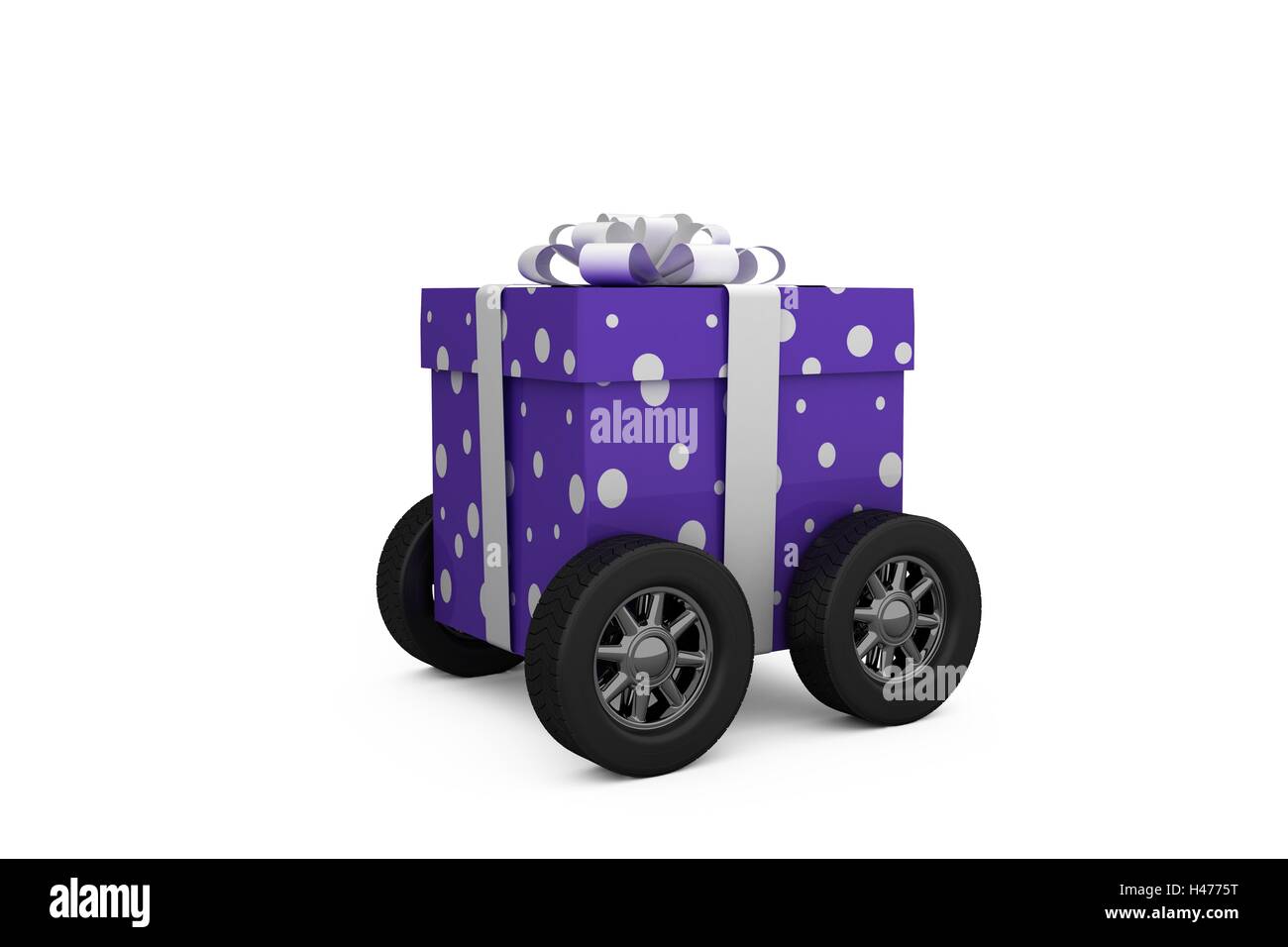 Purple wrapped with polka dot gift box on wheels Stock Photo