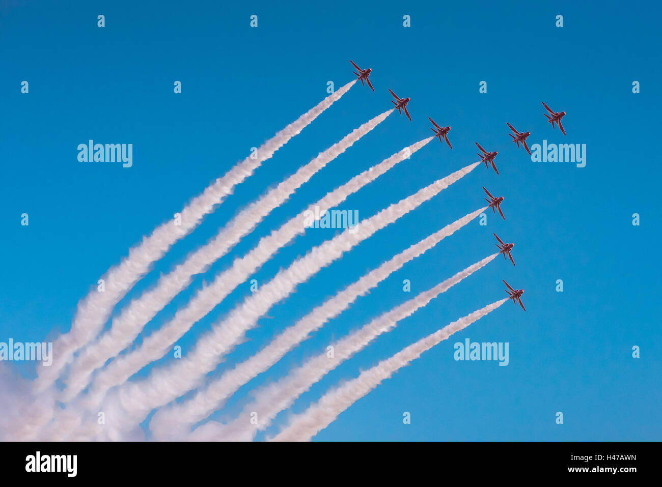 The RAF display team in their Hawk jets in one of their precision flying formations, known as the Swan. Stock Photo
