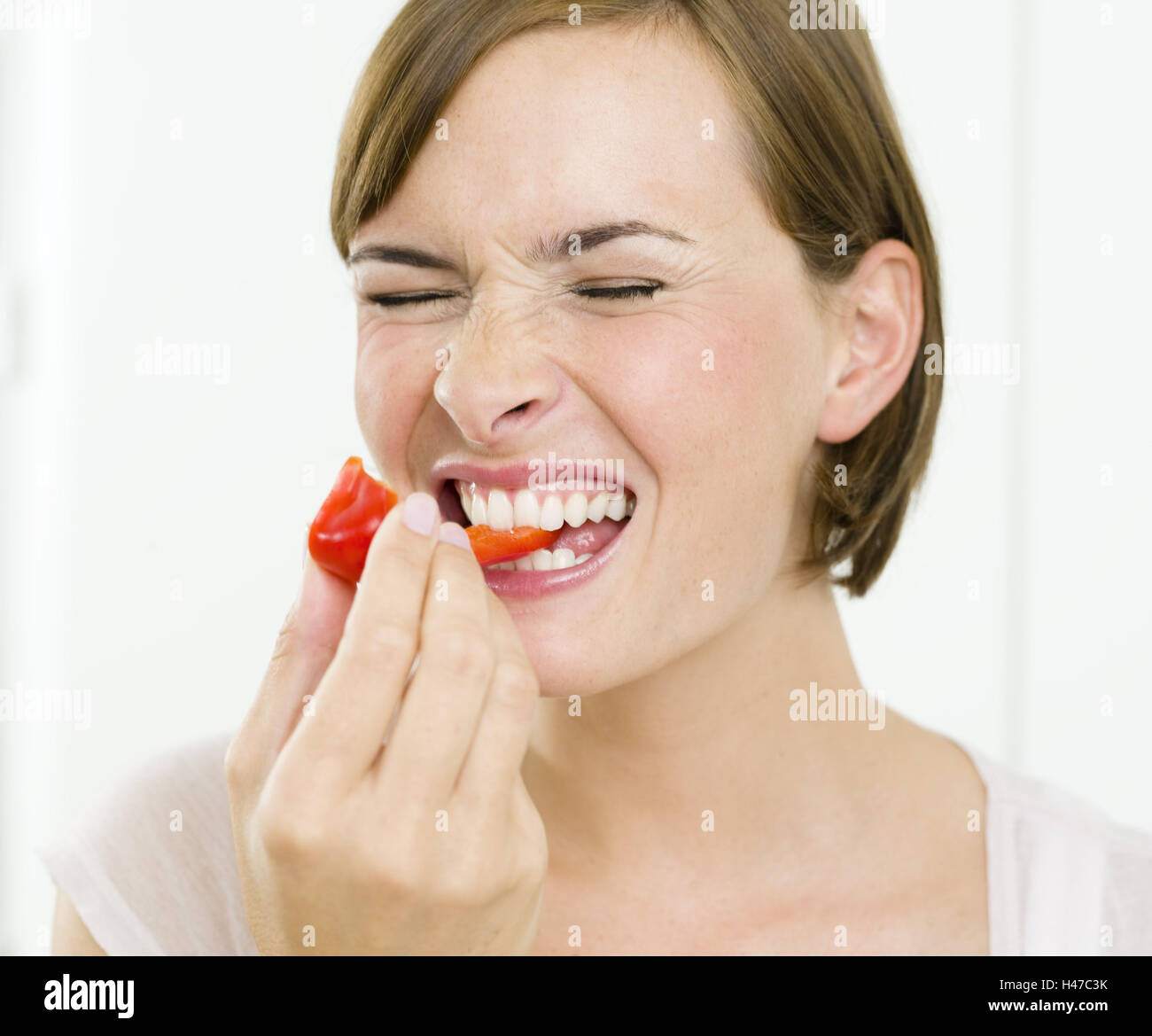 Woman, young, paprika, bite off Stock Photo Alamy