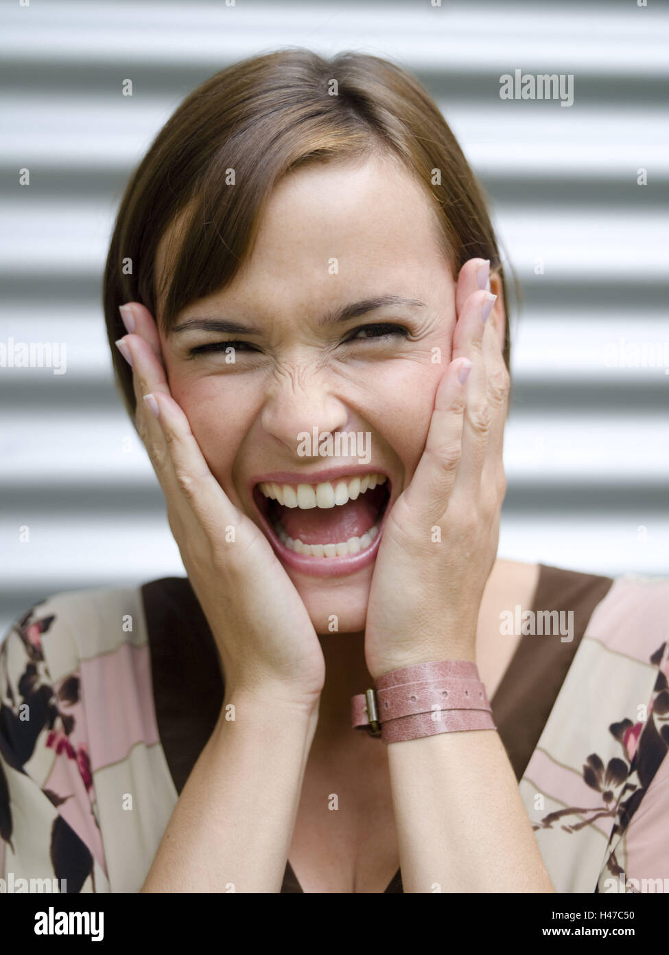 Woman, young, brunette, portrait, hands, look, laugh Stock Photo