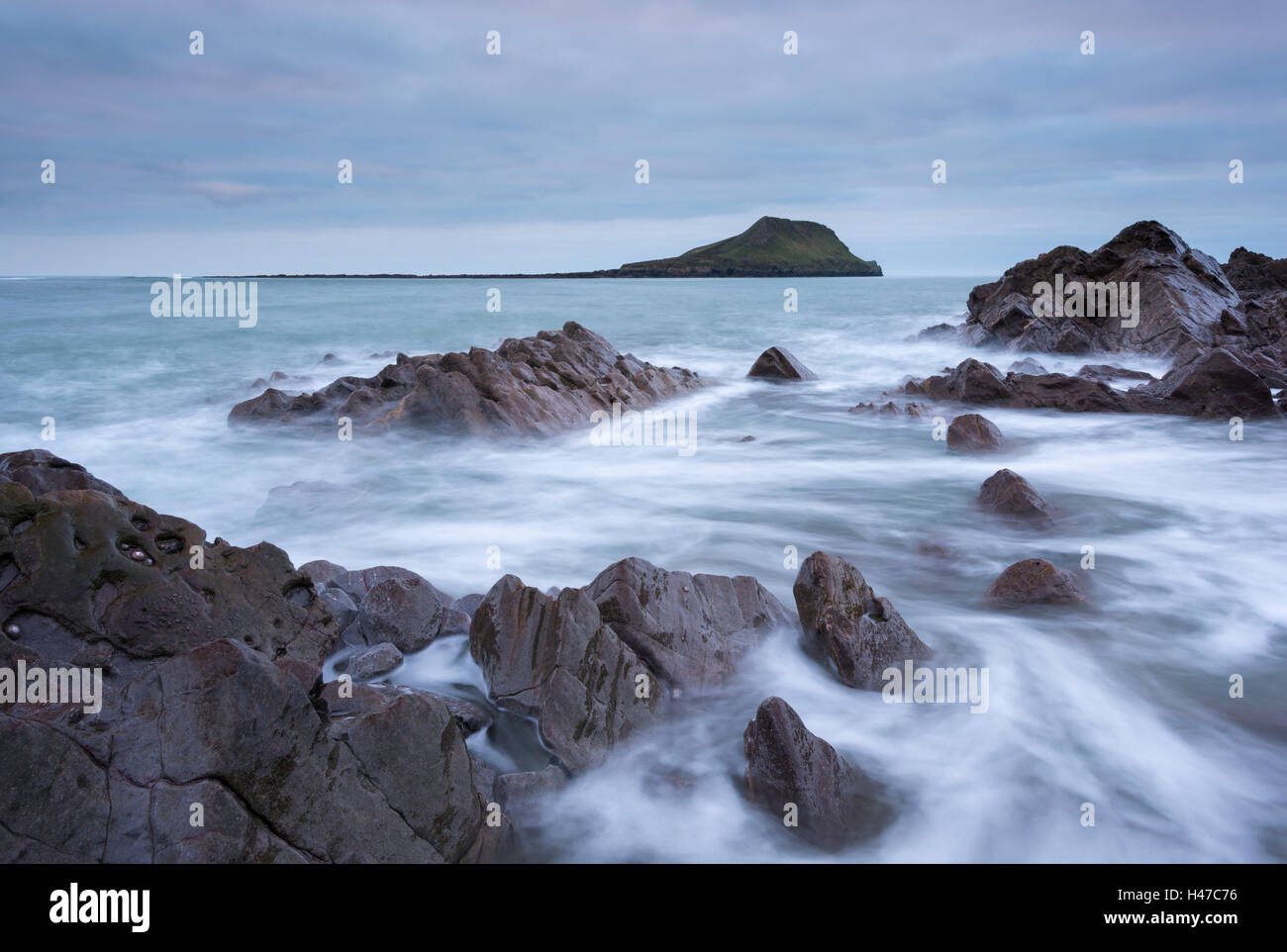 Rocky coast of the Gower looking towards Worm's Head, South Wales, UK. Winter (December) 2014. Stock Photo