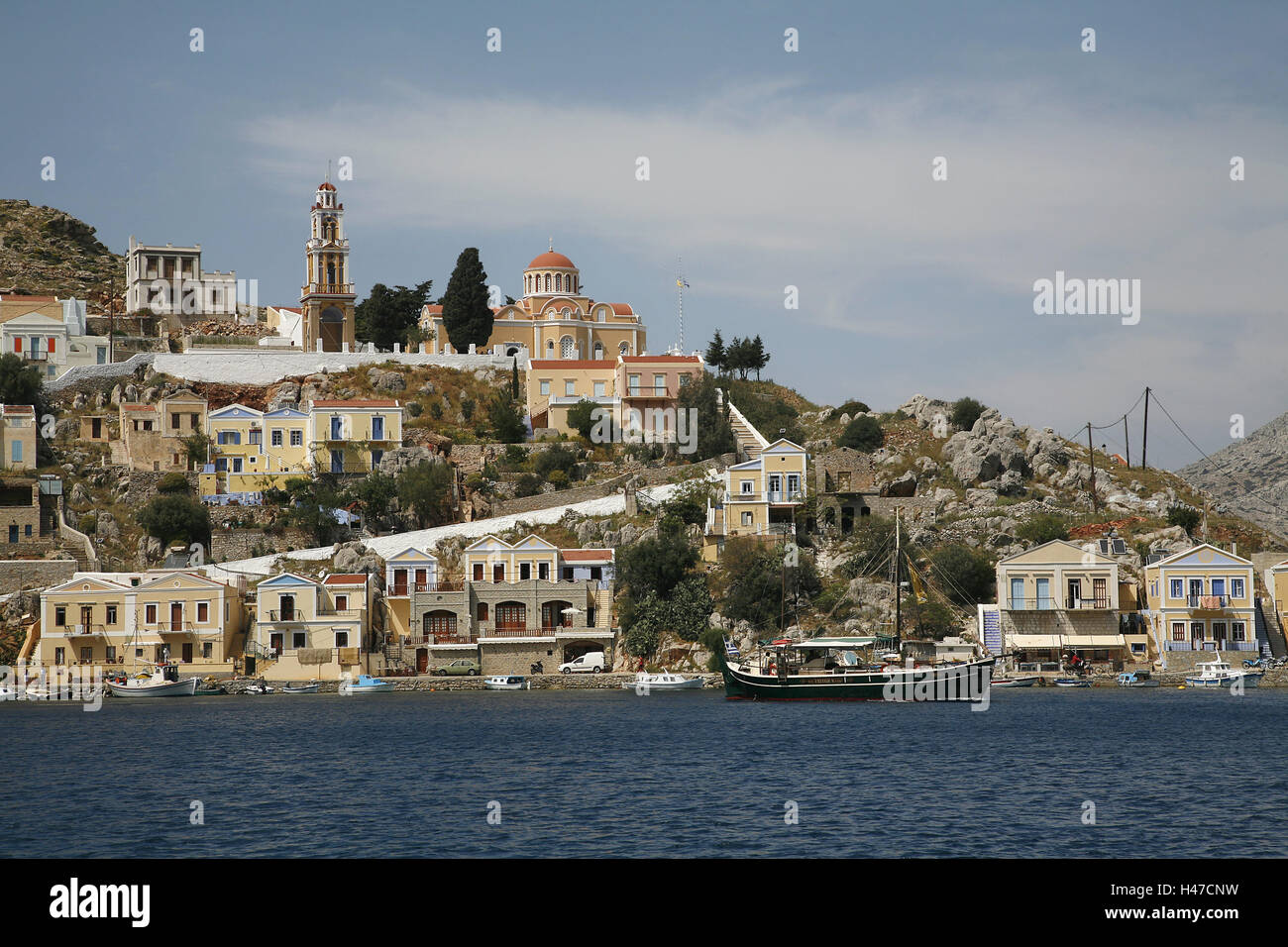 Greece, Dodekanes, Rhodes, island, Symi, harbour place Gialos, town view, church Evangelismos, sea, coast, seashore, coastal place, local view, Simi, town, island capital, hill, Symi town, houses, sacred construction, cloister, bell tower, tower, steeple, Stock Photo
