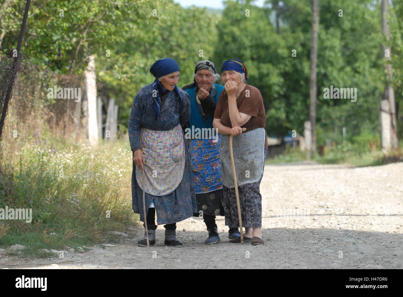 Russia, Severnaya Osetiya, country lane, women, three, old, stand, Stock Photo