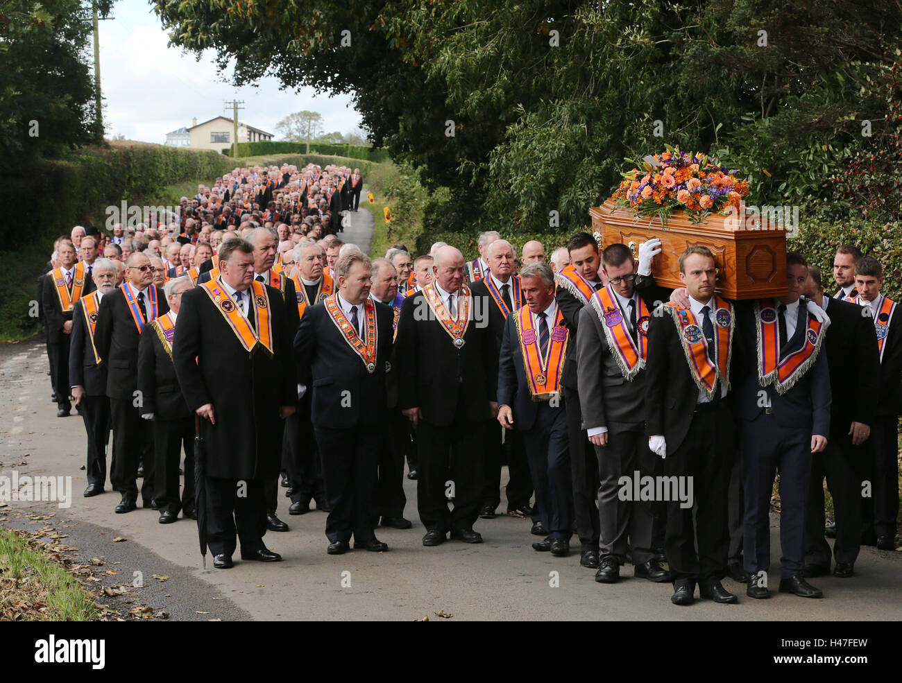 The coffin of high profile Orangeman Drew Nelson makes its way to St John's Church, Hillsborough Co Down, during his funeral. Stock Photo