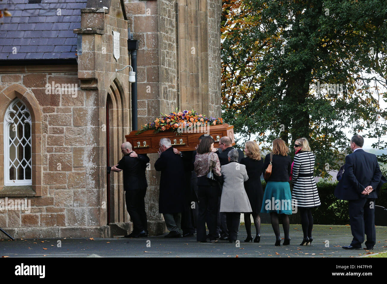 The coffin of high profile Orangeman Drew Nelson makes its way in to St John's Church, Hillsborough Co Down, during his funeral. Stock Photo