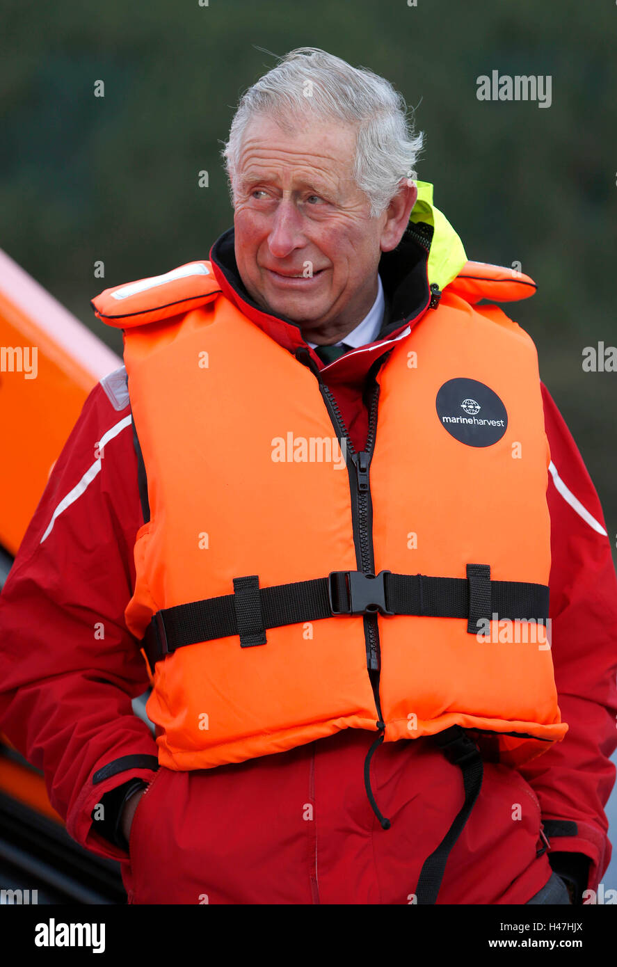 The Prince of Wales, known as the Duke of Rothesay while in Scotland, during a visit to a sustainable salmon farm at Marine Harvest's Loch Leven Fish Farm, on Loch Leven at Onich, by Fort William, Inverness-shire. Stock Photo