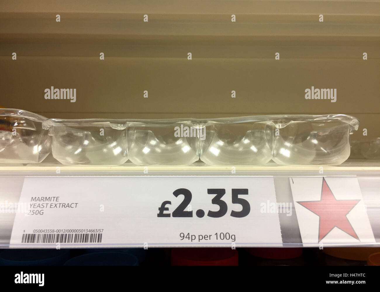 An empty shelf where Marmite should be in a Tesco store in Andover, Hampshire, as Unilever's finance chief admitted that the prices of its popular products will rise as a result of the collapse in sterling, a day after the firm was accused of 'exploiting consumers' following a row with Tesco. Stock Photo