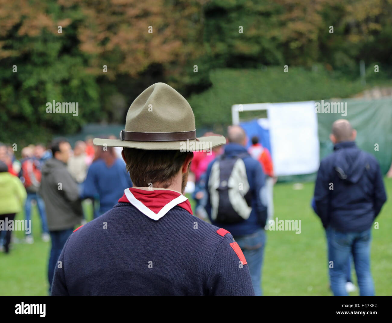 scout chief at international meeting in uniform with campaign hat and neckerchief white and red Stock Photo