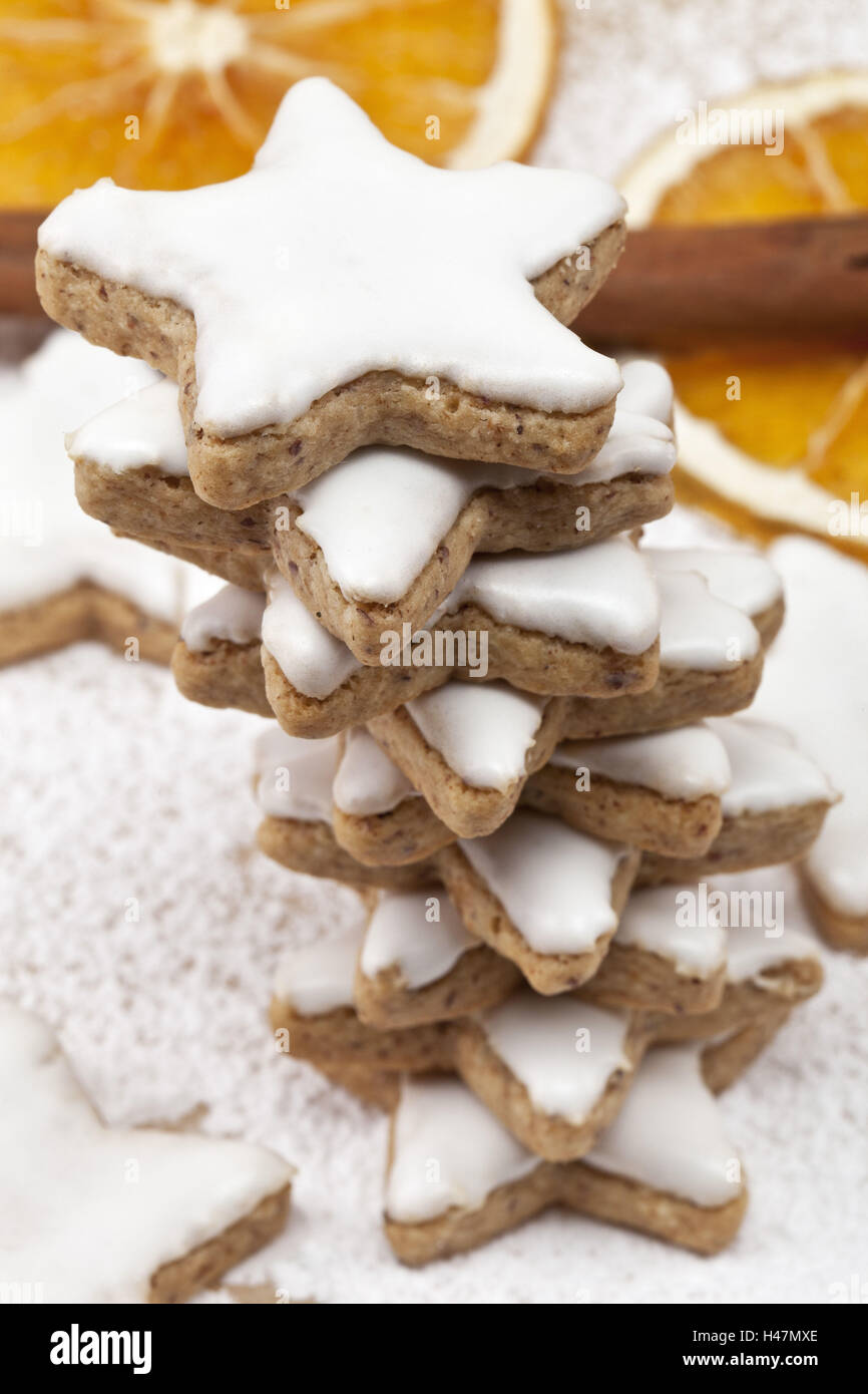 Cinnamon stars, stacked, icing sugar, cinnamon sticks, Sliced orange, detail, blur, Stock Photo