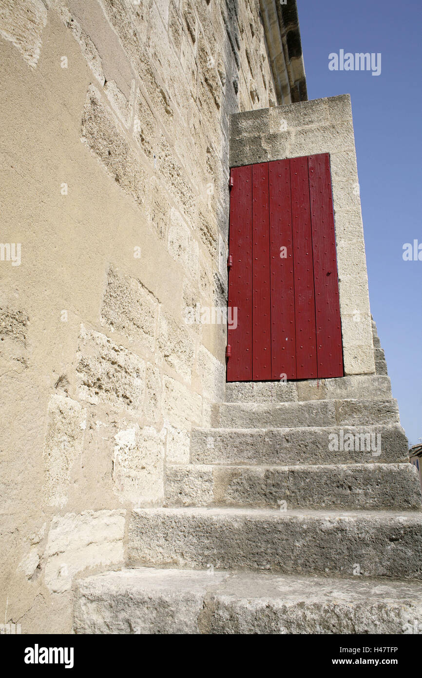 France, Languedoc-Roussillon, Gard, Aigues-Mortes, city wall, stairs, door, red, summer, town, city fortification, structure, historically, defensive wall, exit, input, passage, stairs rising, outside stairs, stone stairs, steps, rising, wooden door, closed, to, nobody, outside, Stock Photo