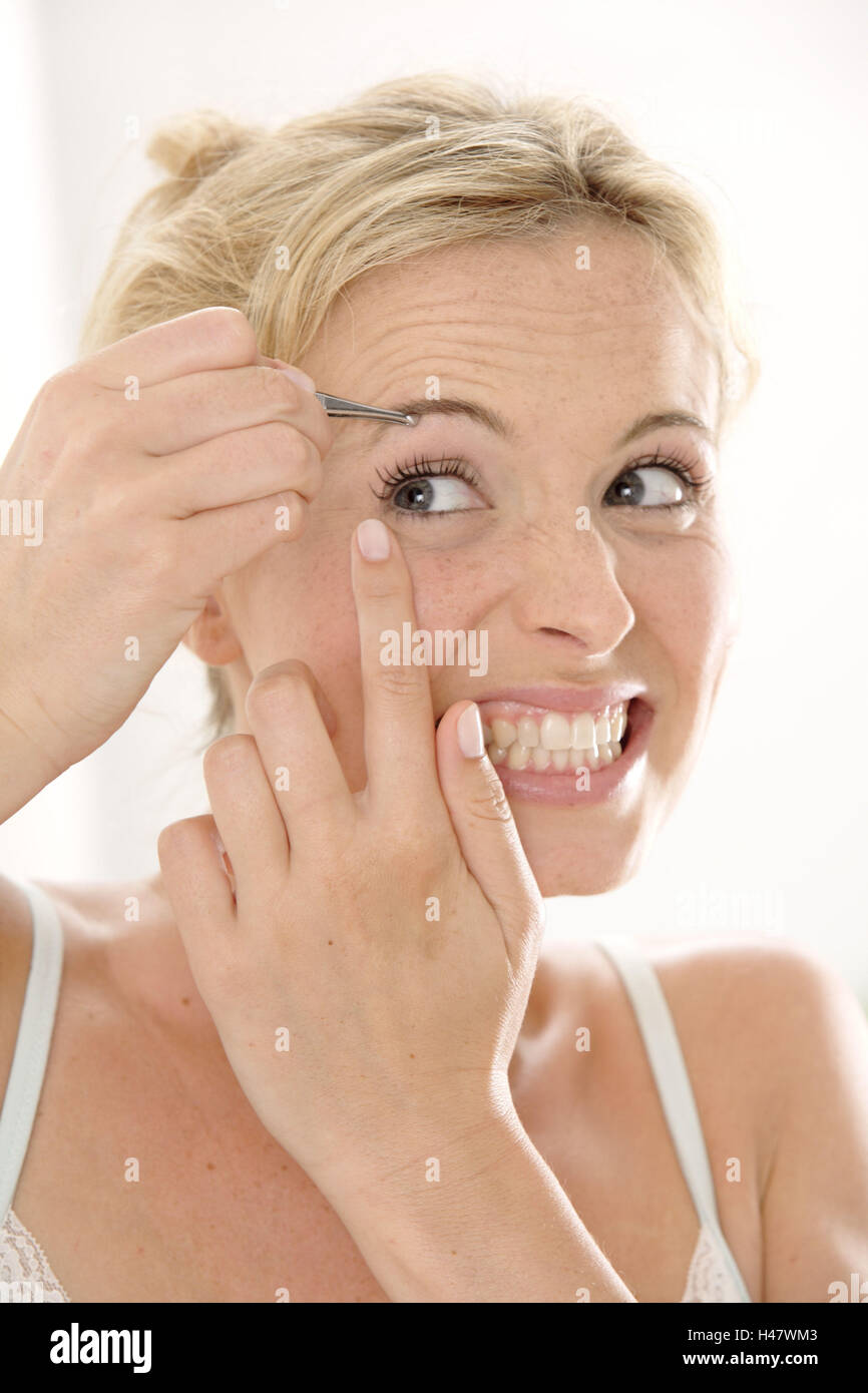 Woman, beauty, cosmetics, tweezers, pluck, painful, facial expression